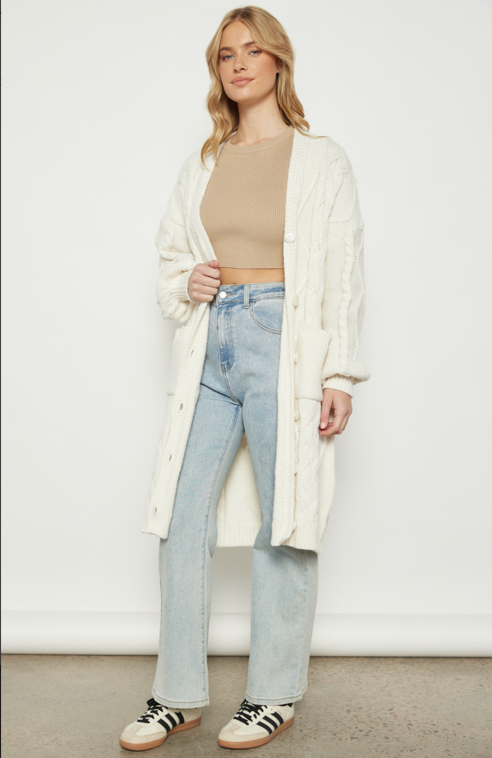 Ivory Cable Knit Long Cardigan with
Buttons and Pocket Detail